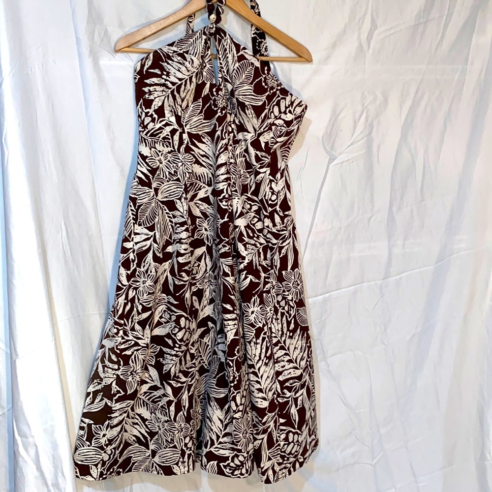 The dress is a flare out dress . The material is 97% cotton and 3% Spandex